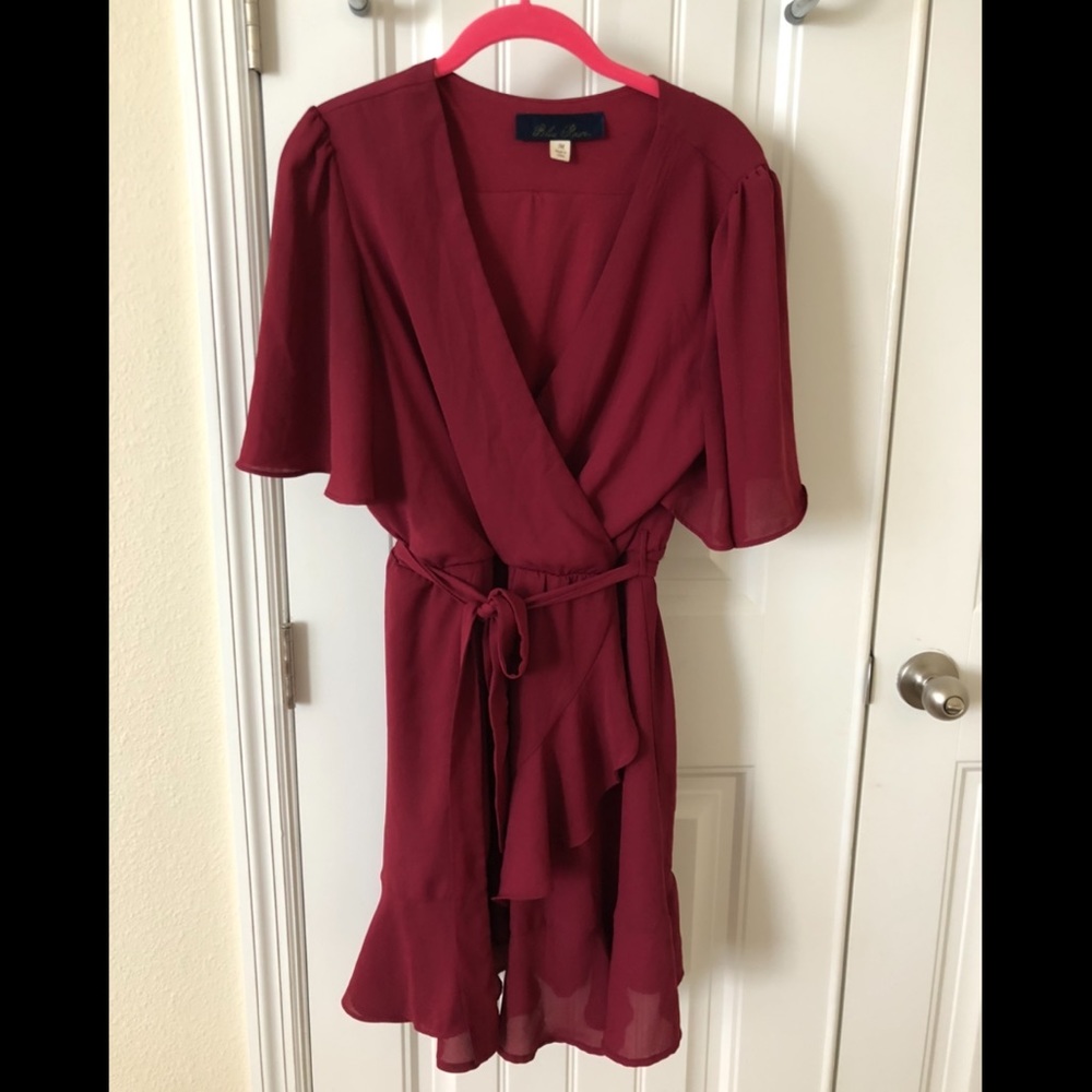Francesca’s mock wrap wine colored flows dress